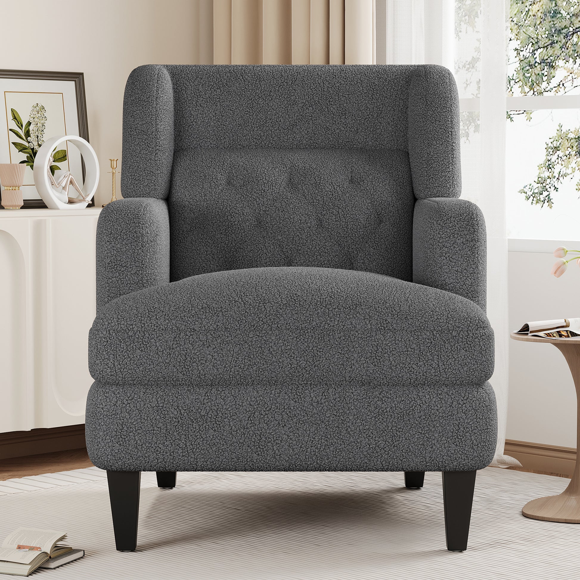 Cozy gray teddy fabric armchair with tufted back and black wooden legs