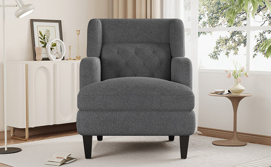 Cozy dark grey textured armchair with button tufting and rolled arms