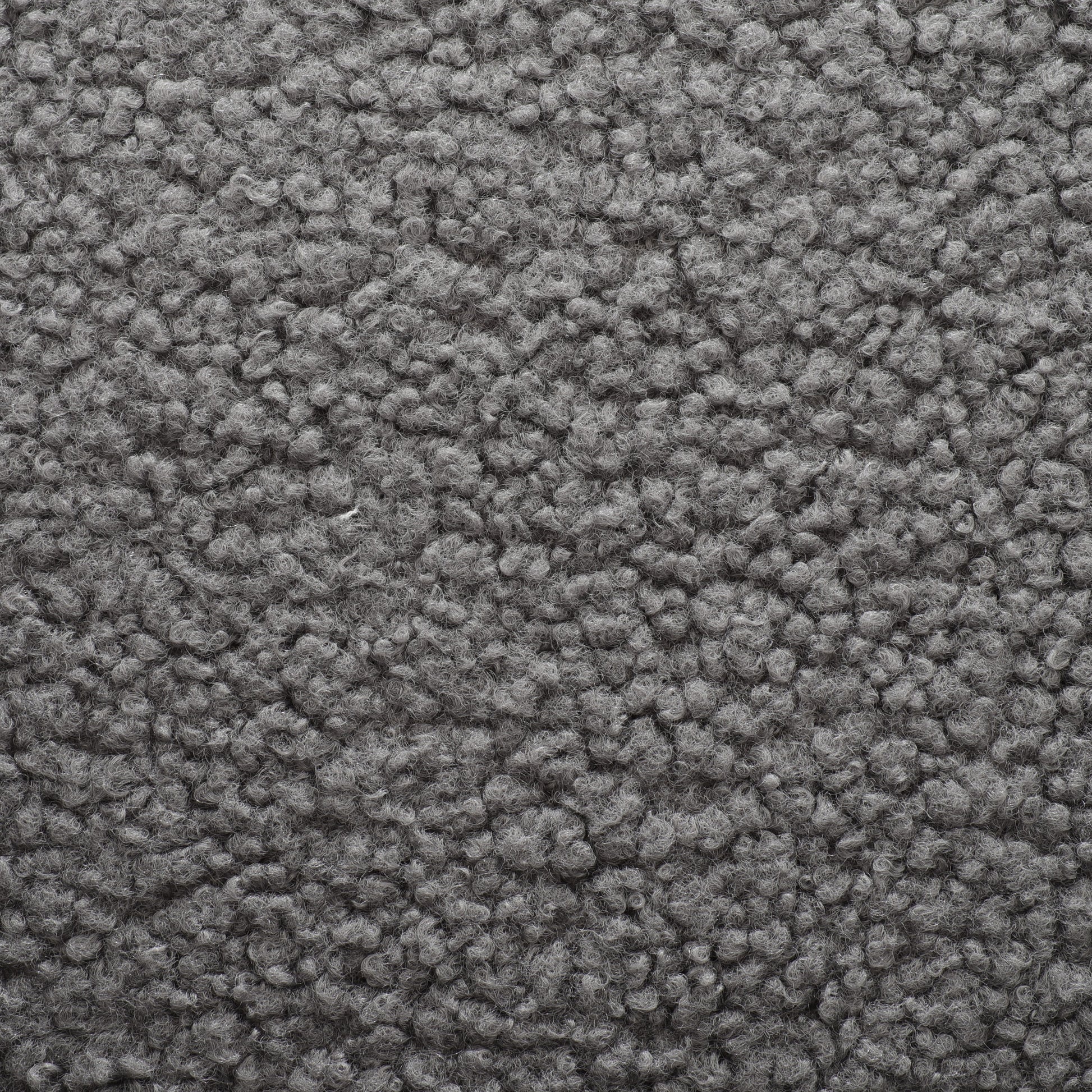 Closeup view of textured grey sherpa fabric perfect for cozy apparel and home decor