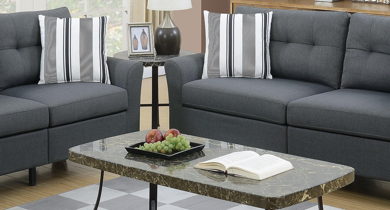 Charcoal gray sectional sofa with tufted cushions and black legs