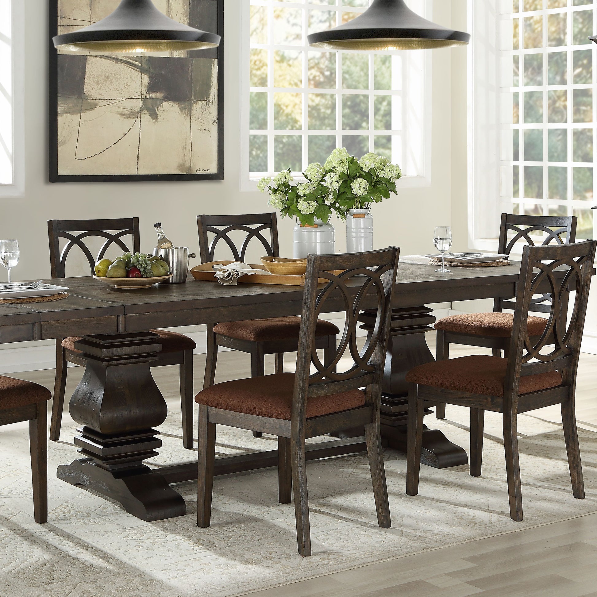 Dark oak dining table set with upholstered chairs featuring intricate back designs