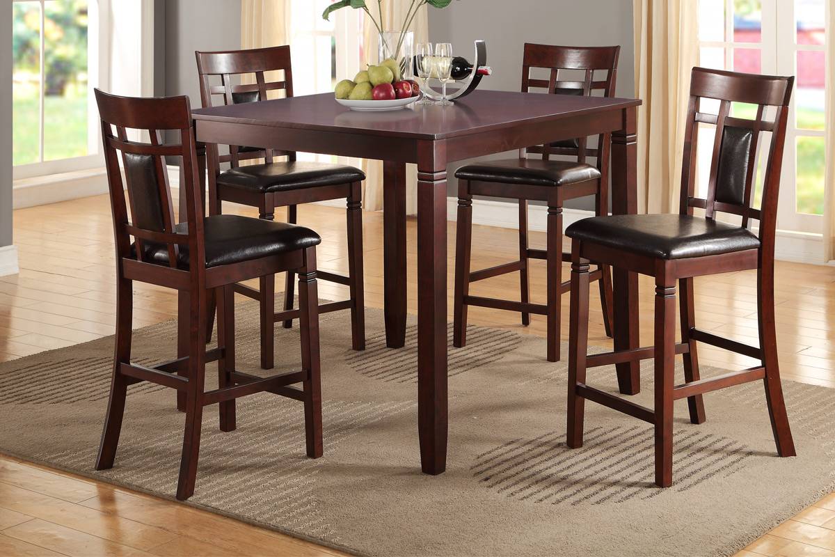 Dark cherry wood bar table with four upholstered counter stools perfect for a dining nook