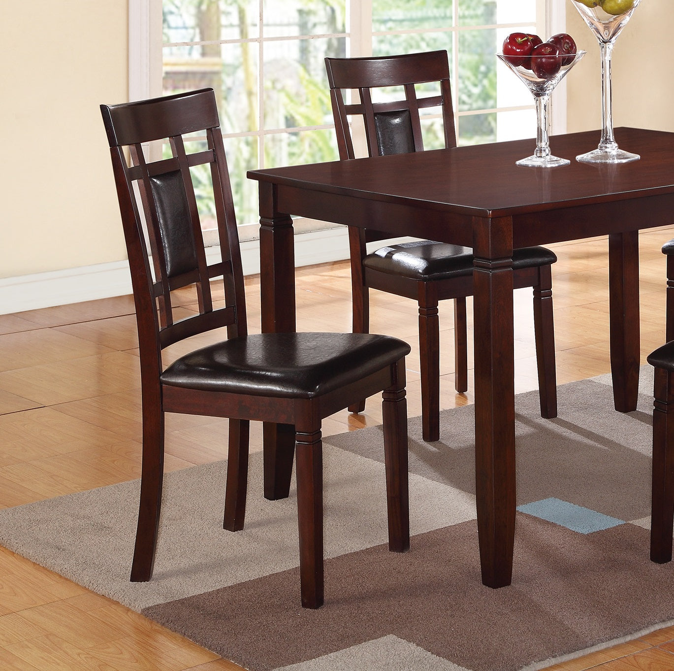 Dark wood dining chair with upholstered seat and geometric backrest