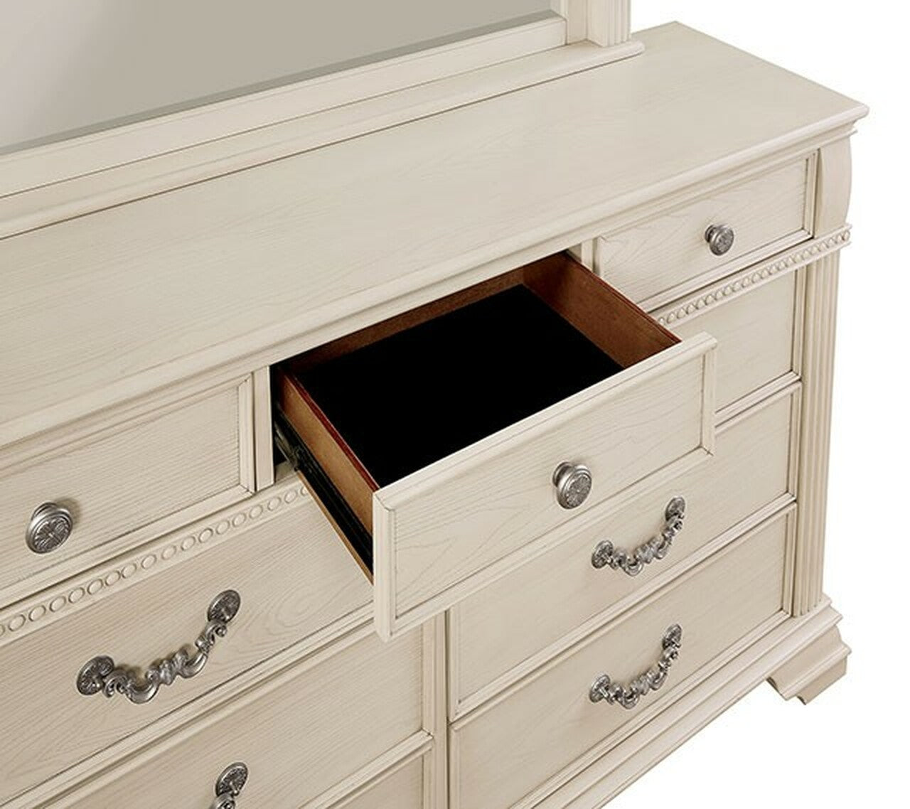 Cream dresser with ornate silver hardware one drawer open