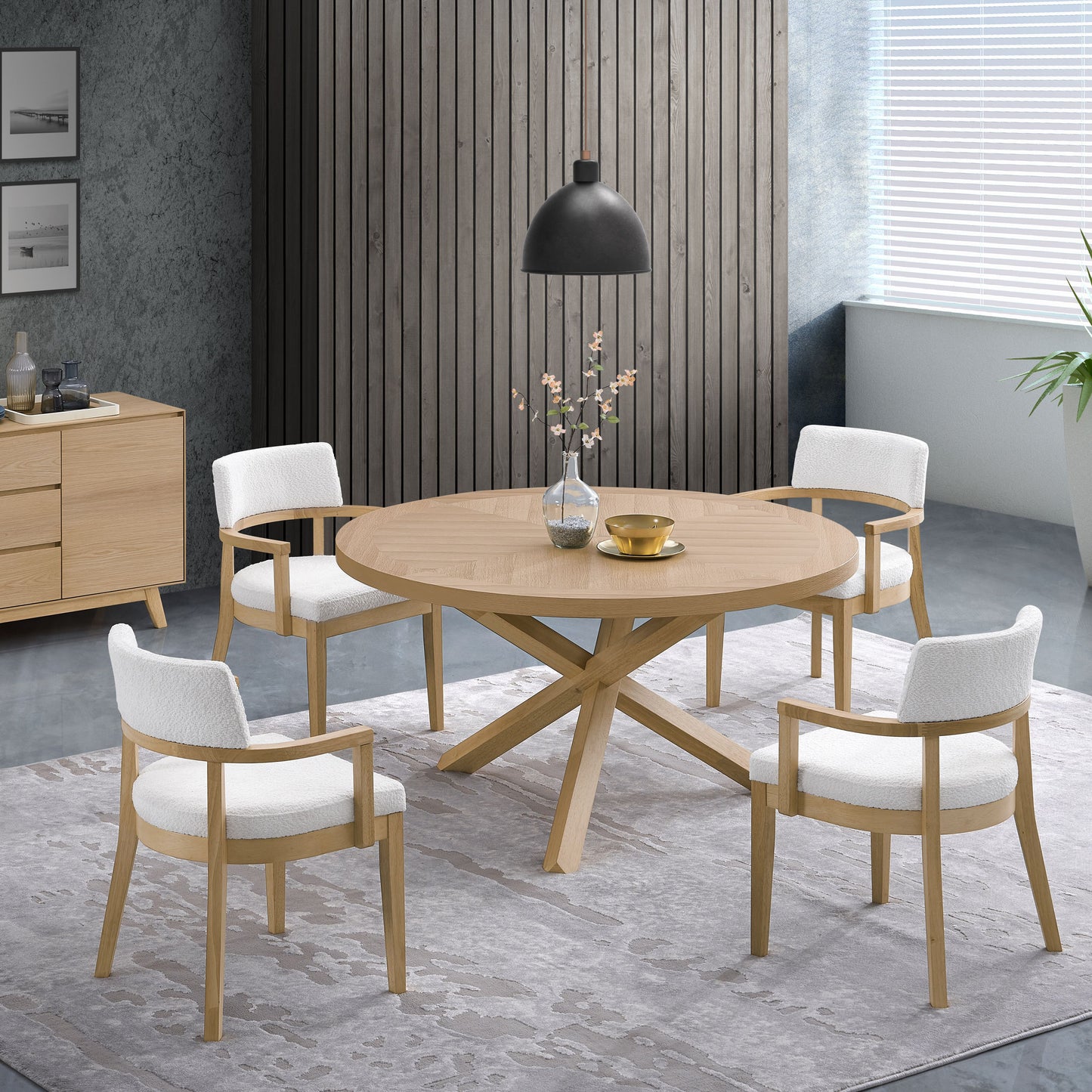 Round oak dining table with four white boucl armchairs perfect for modern dining rooms