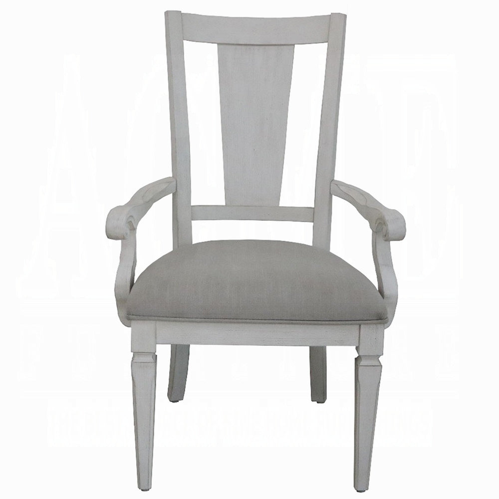 White upholstered arm chair with distressed finish for dining room