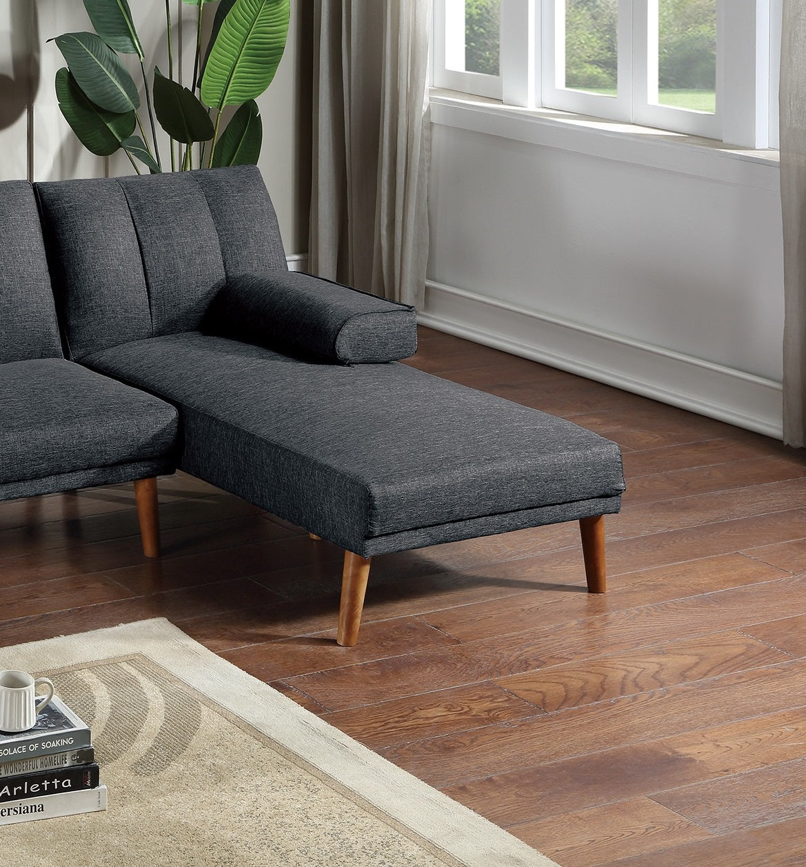 Dark gray sectional sofa with chaise lounge and wooden legs