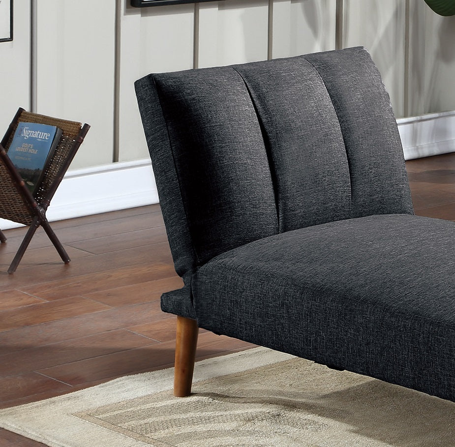 Charcoal grey upholstered chaise lounge with buttontufted backrest and wooden legs