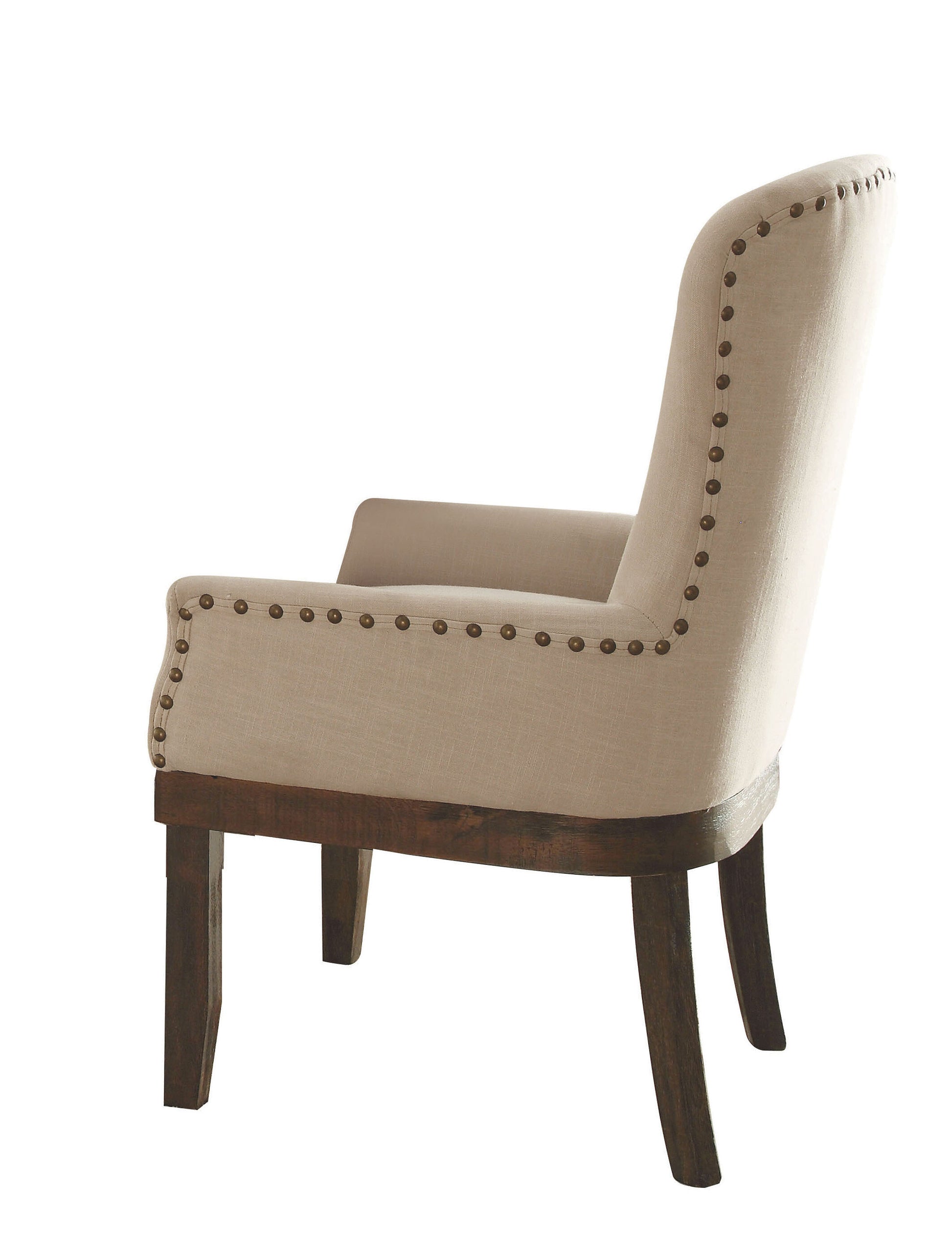 Beige upholstered wingback accent chair with nailhead trim and dark wood legs
