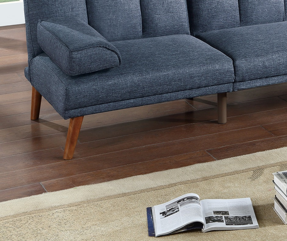 Navy blue upholstered sofa with tufted back and wooden legs perfect for modern living rooms