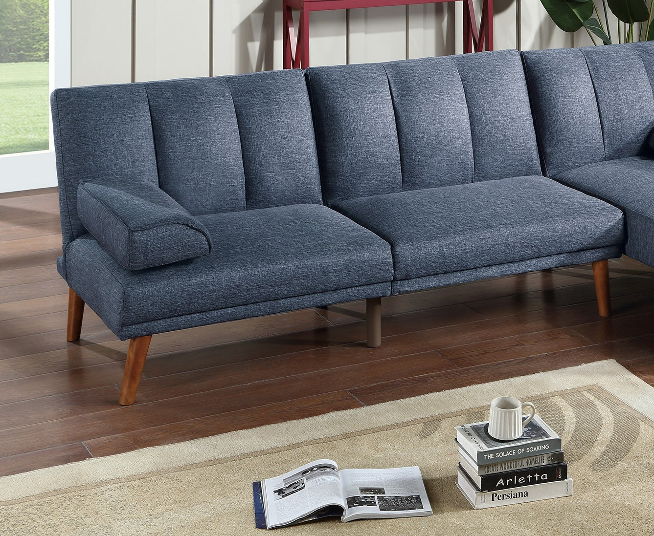 Navy blue linen sectional sofa with tufted back and wooden legs
