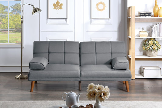 Grey fabric convertible sofa with wooden legs and tufted cushions perfect for small apartments