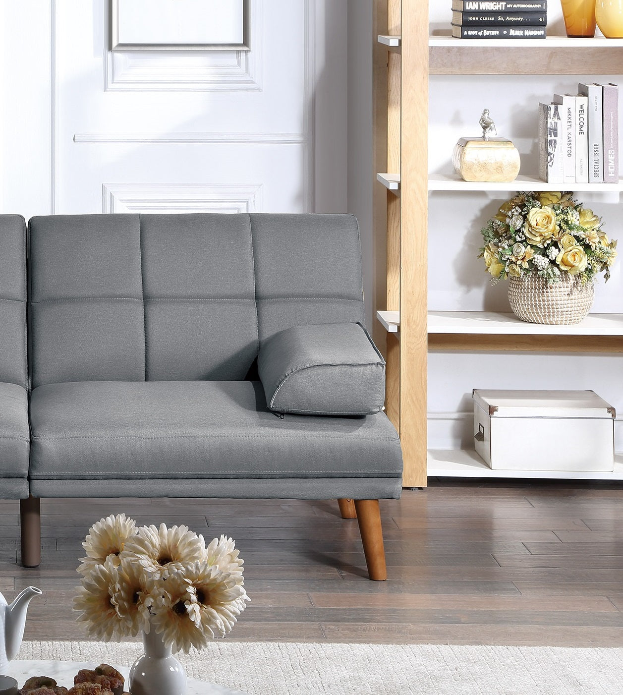 Gray upholstered sofa with wooden legs perfect for modern living rooms