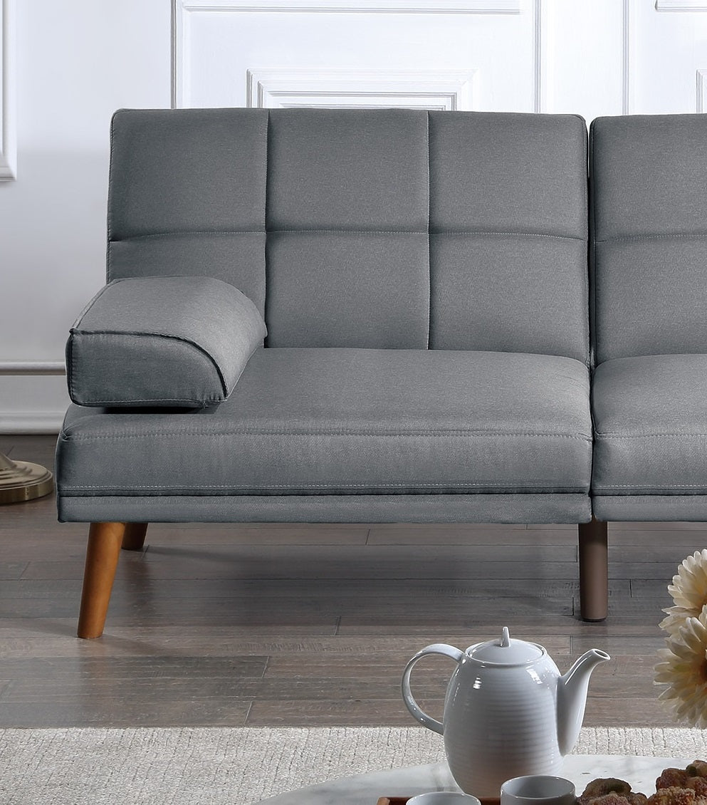 Gray upholstered sofa with tufted back cushions and wooden legs perfect for modern living rooms