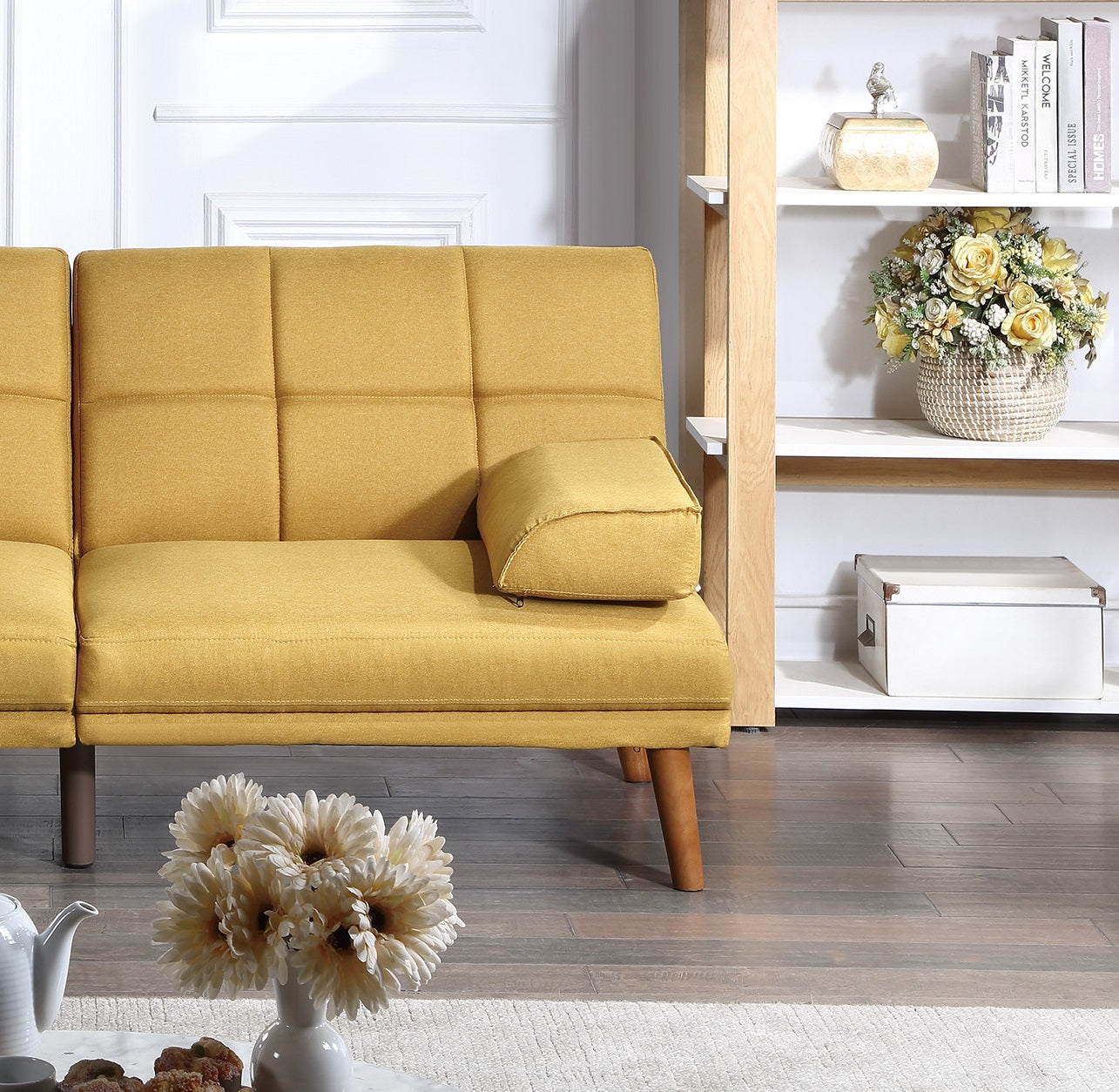 Yellow linen upholstered sofa with modern tufted design and wooden legs