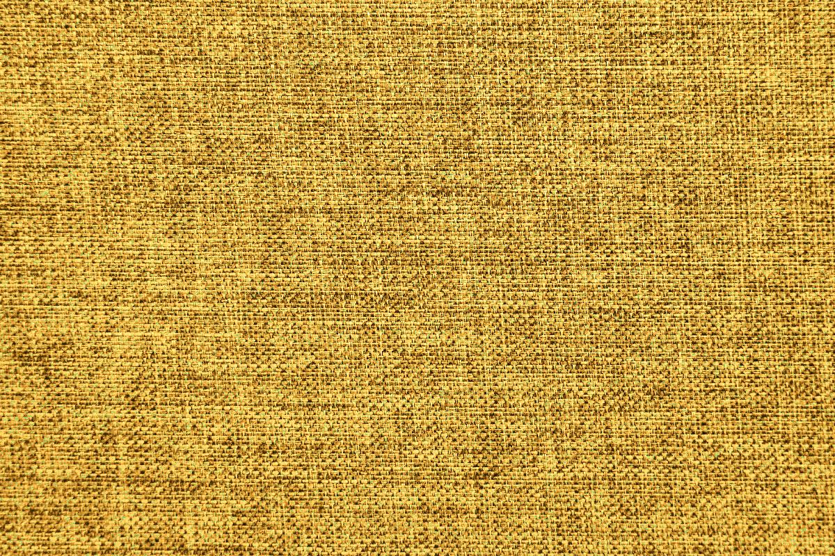 Golden yellow woven fabric texture with a subtle marled pattern