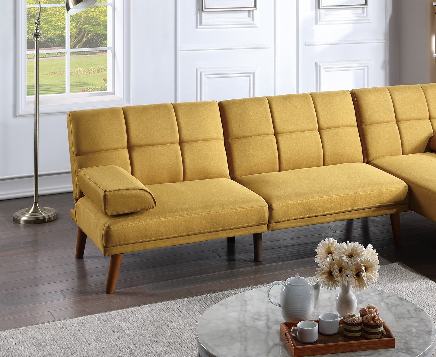Modern mustard yellow linen sofa with tufted cushions and tapered wooden legs ideal for small spaces