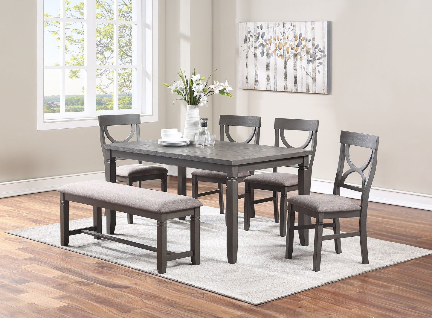 Dark gray dining set with upholstered bench and chairs set for four people