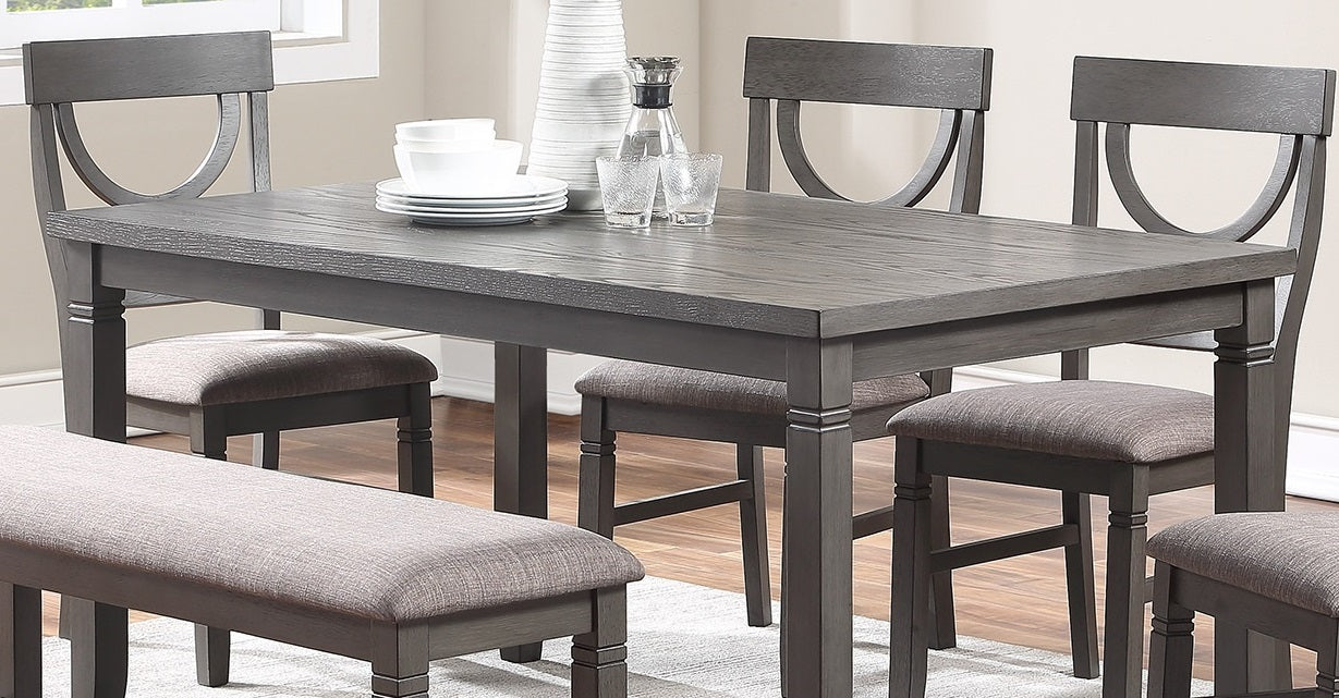 Grey wood dining table with upholstered bench and chairs perfect for casual meals