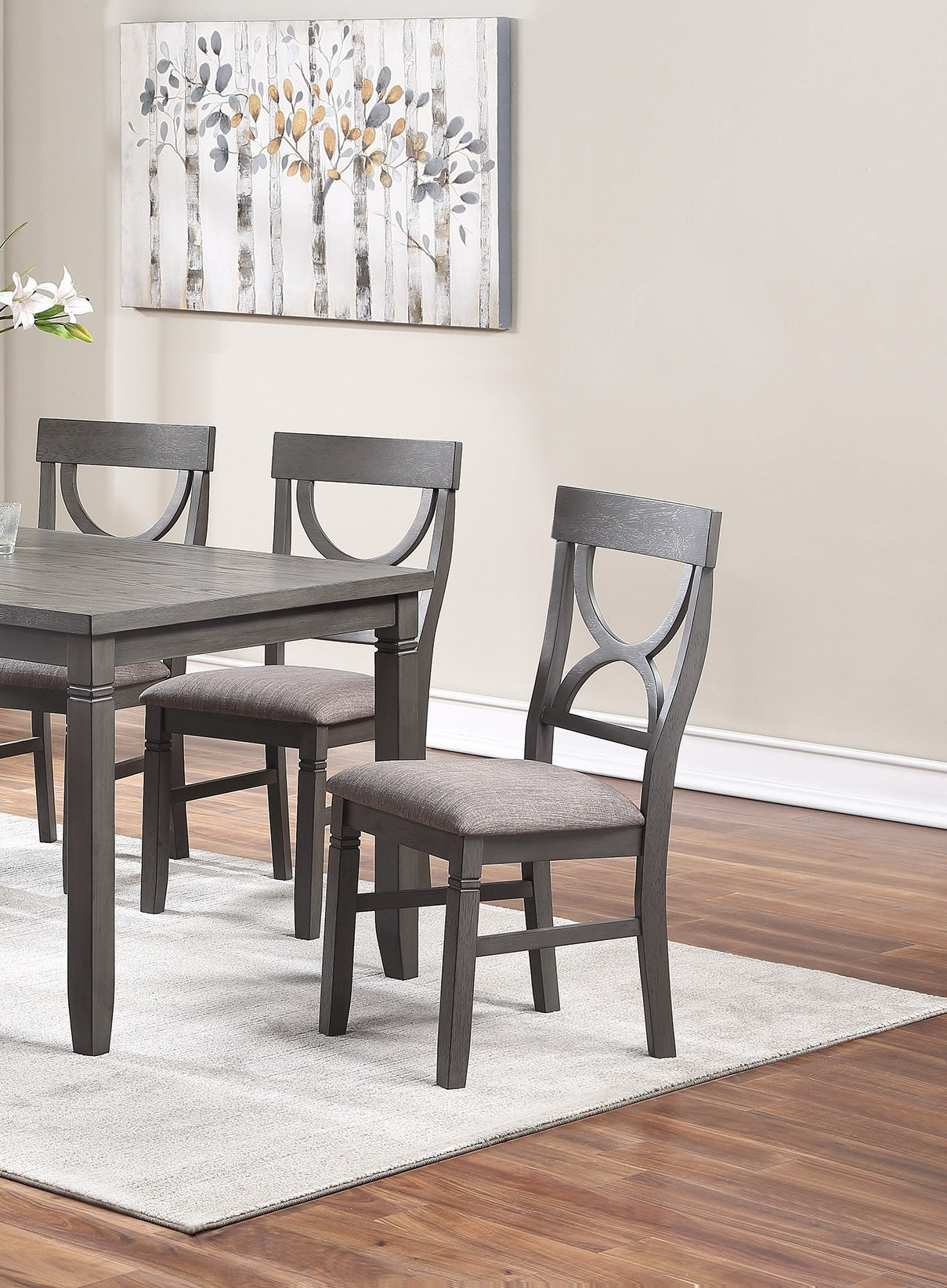 Dark gray wooden dining chair with upholstered seat and Xback detail