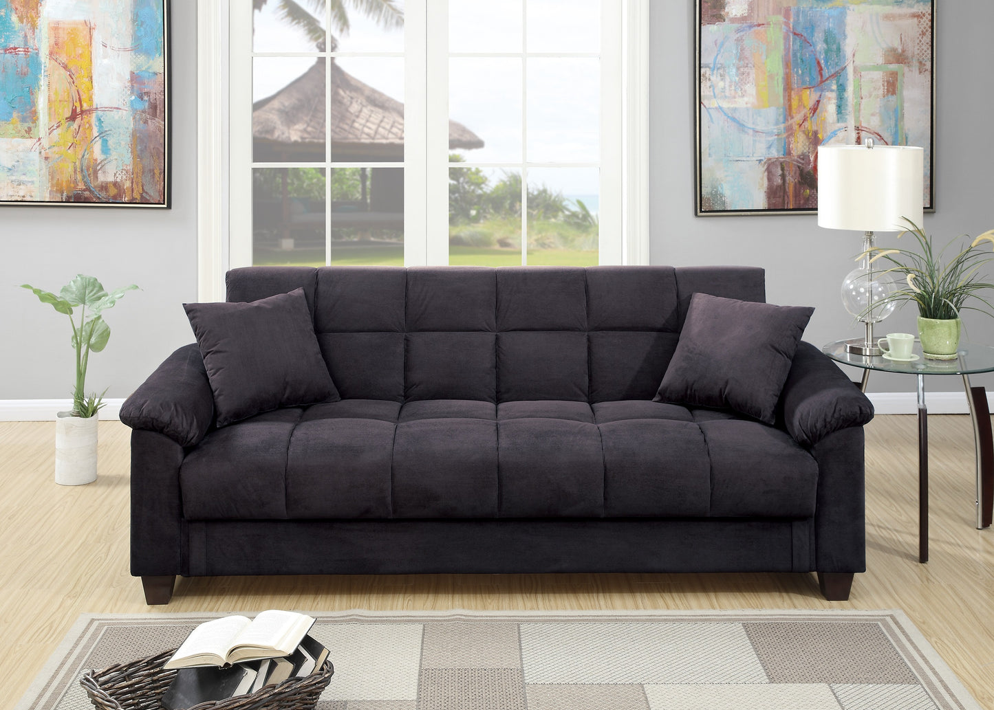 Dark gray tufted futon with included throw pillows perfect for small spaces