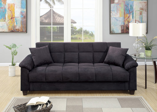 Dark gray tufted futon with included throw pillows perfect for small spaces