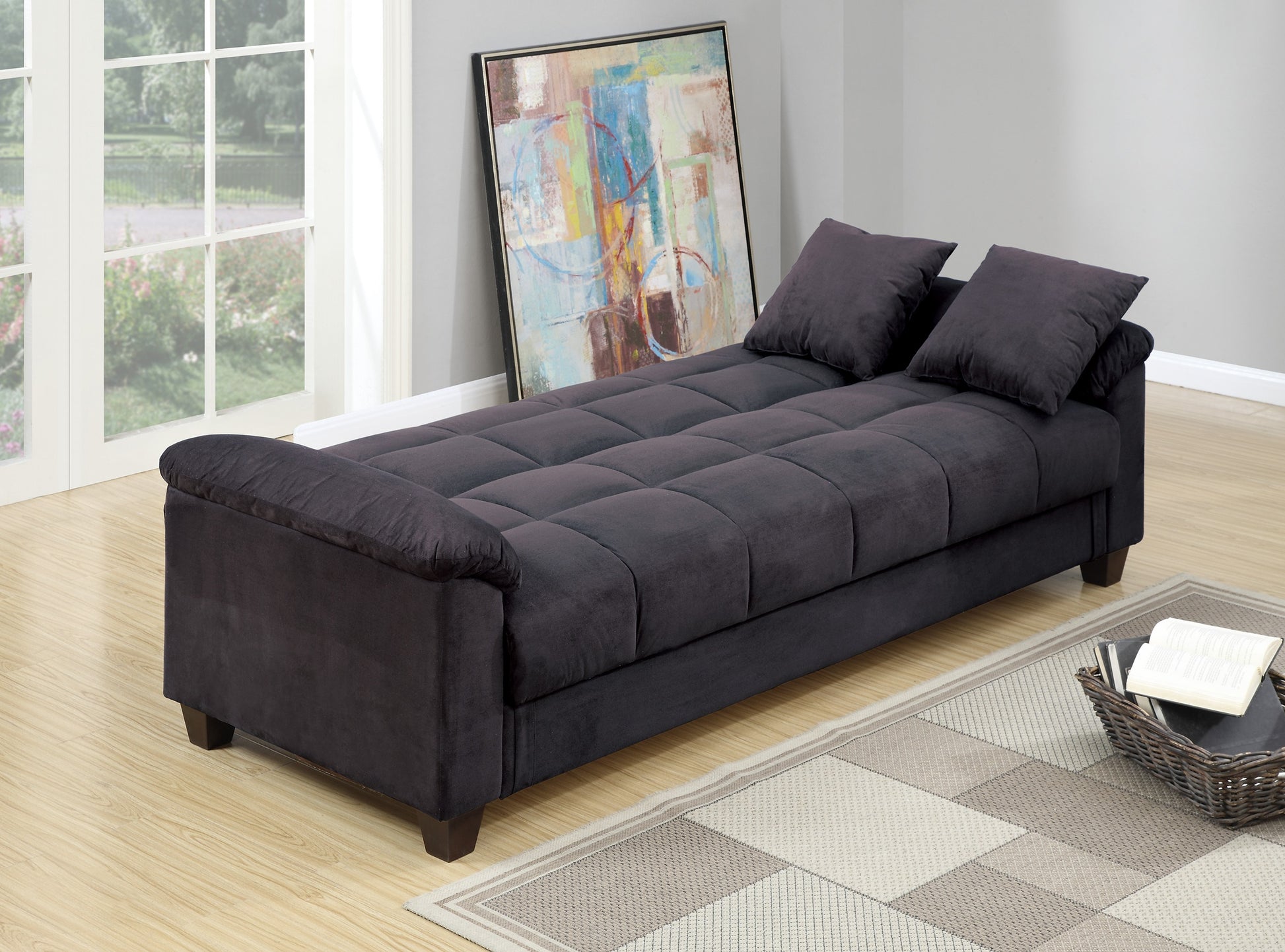 Tufted charcoal sofa bed with two dark grey pillows modern style for living rooms