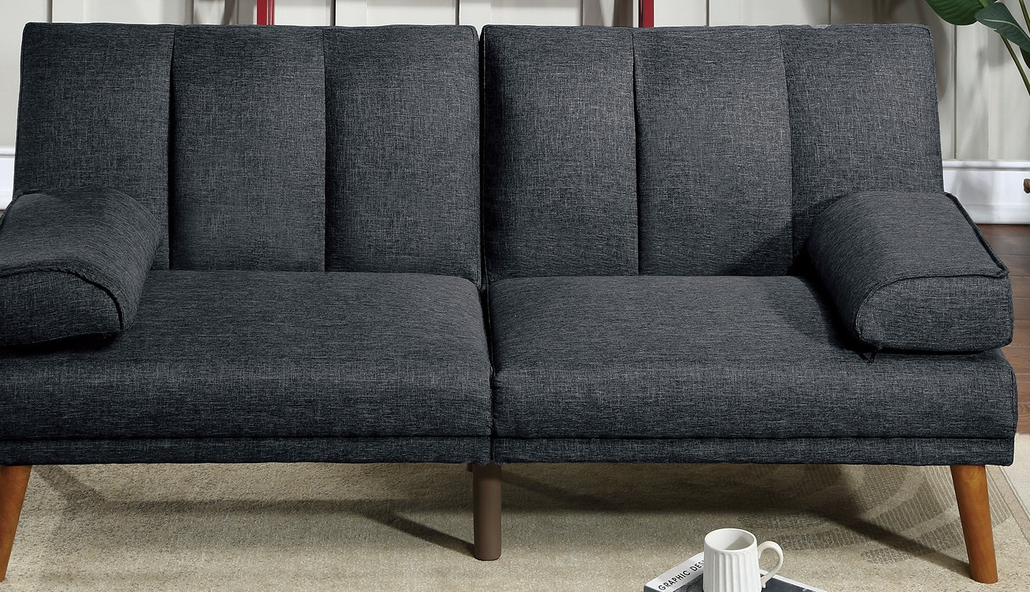 Dark gray upholstered loveseat sofa with channel tufting and wooden legs