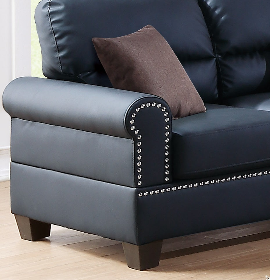 Black leather sofa with studded armrest detail
