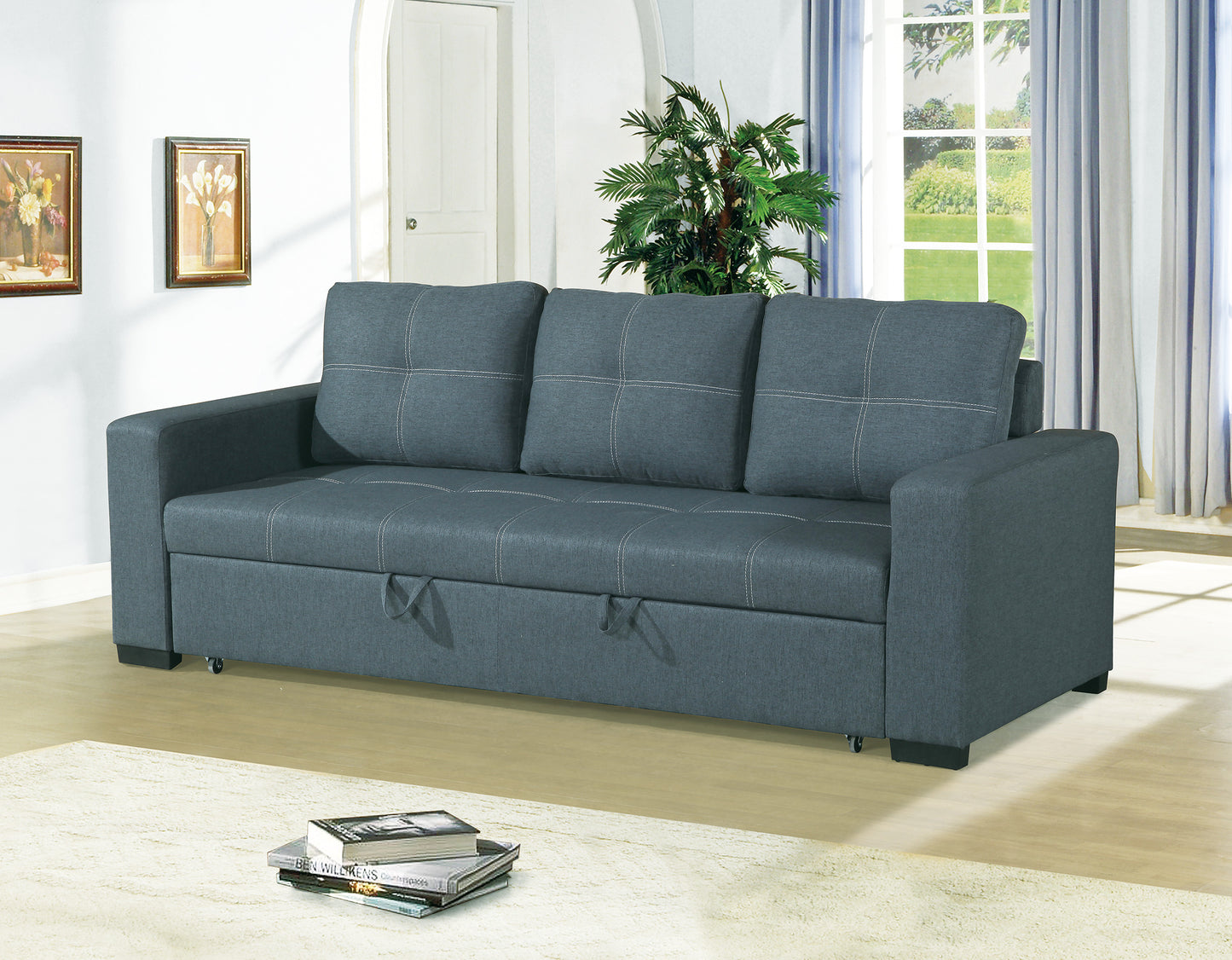 Dark gray linen sofa bed with white stitching and pull tabs for storage