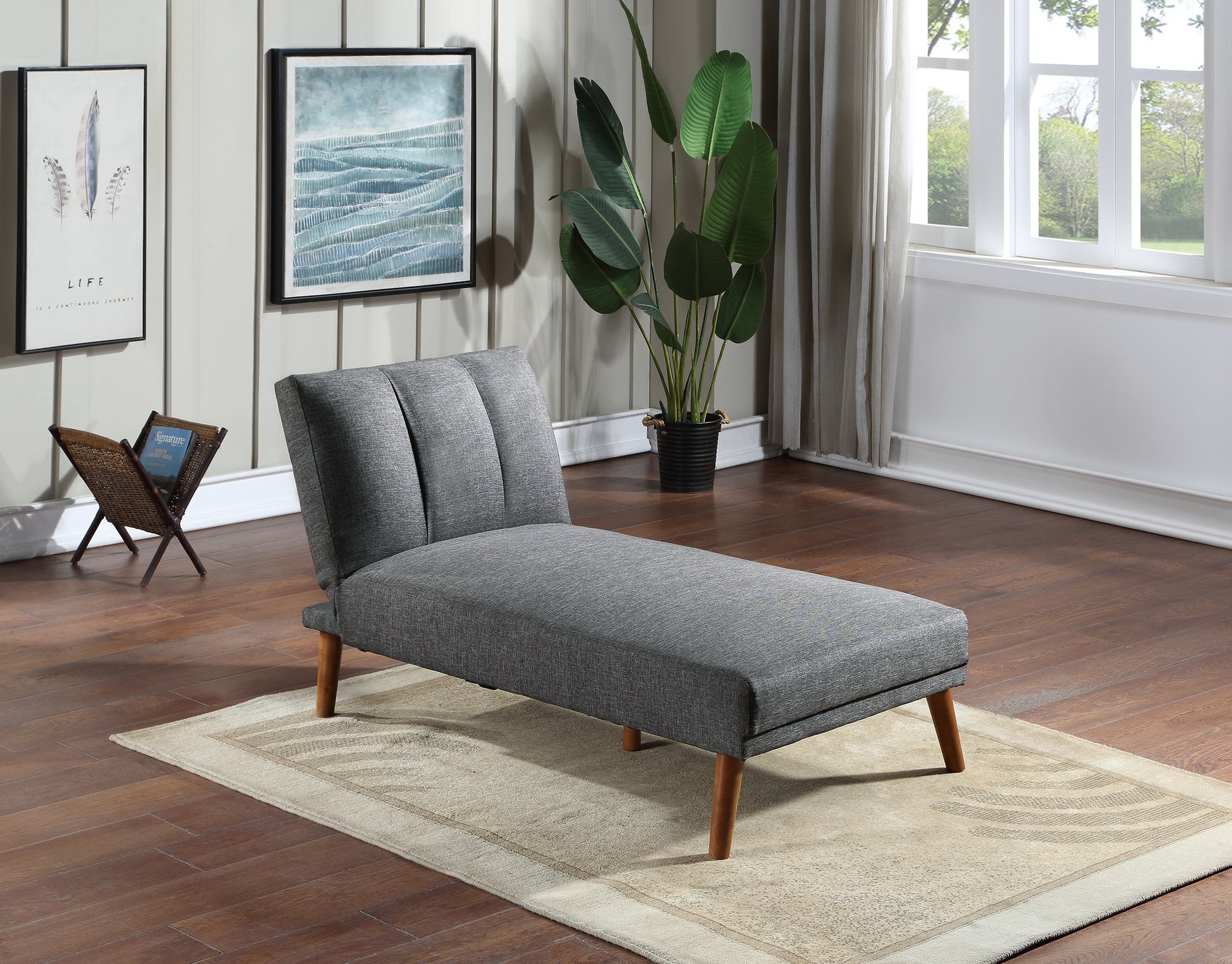 Grey fabric chaise lounge with tufted backrest and wooden legs