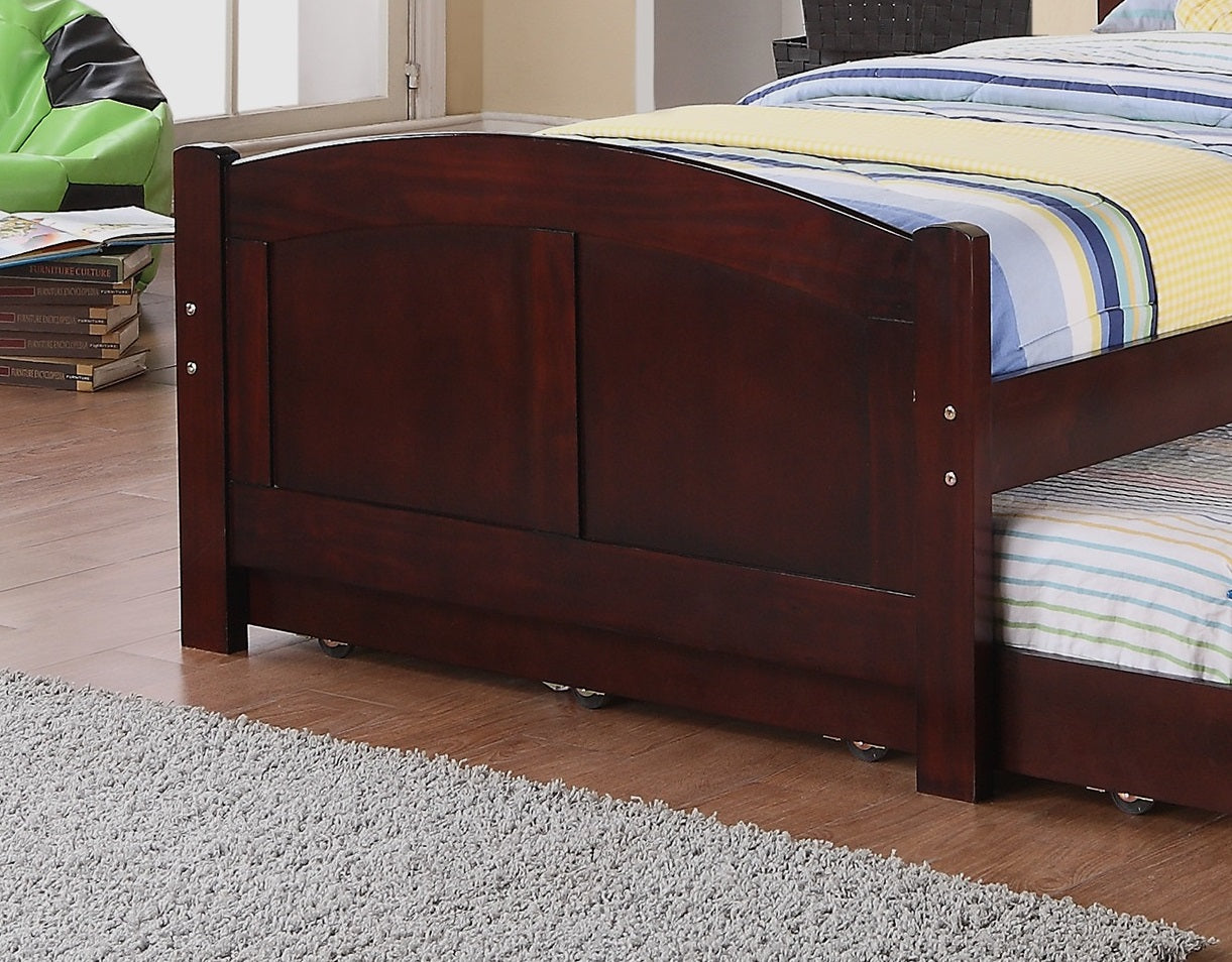 Dark cherry wood toddler bed with arched headboard and pullout trundle
