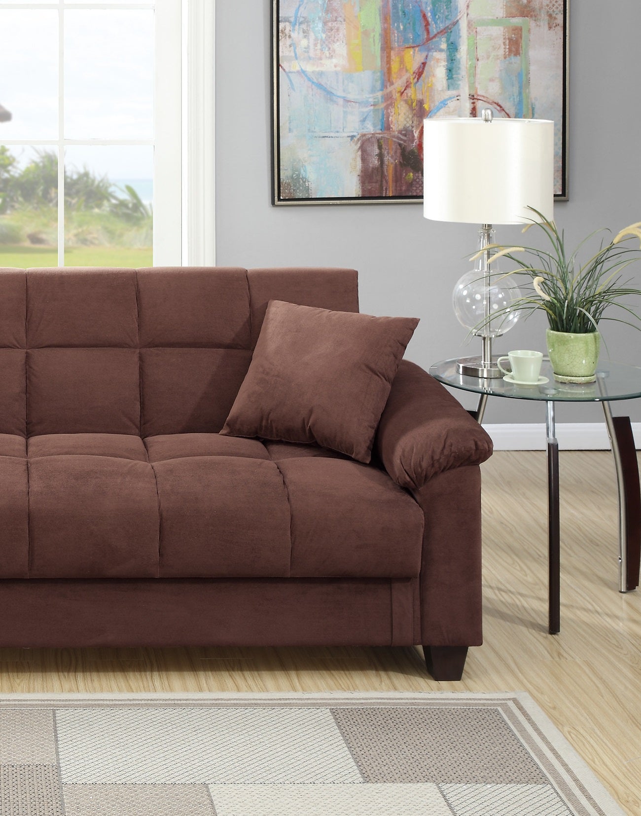 Brown microfiber tufted sofa with matching throw pillow for cozy living room seating