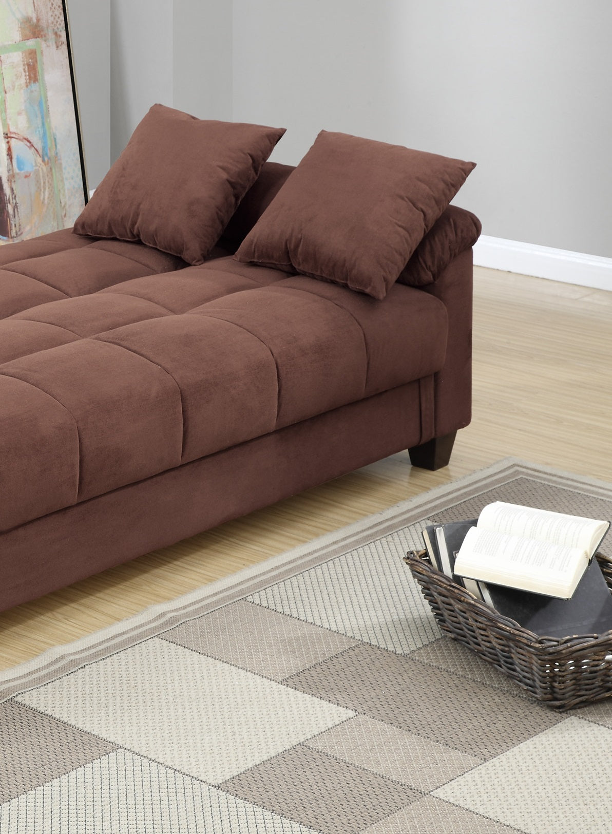 Brown velvet tufted sofa with plush throw pillows for a cozy living room seating arrangement