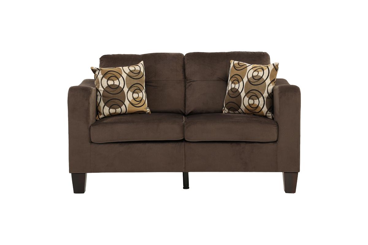 Brown velvet loveseat with geometric patterned throw pillows