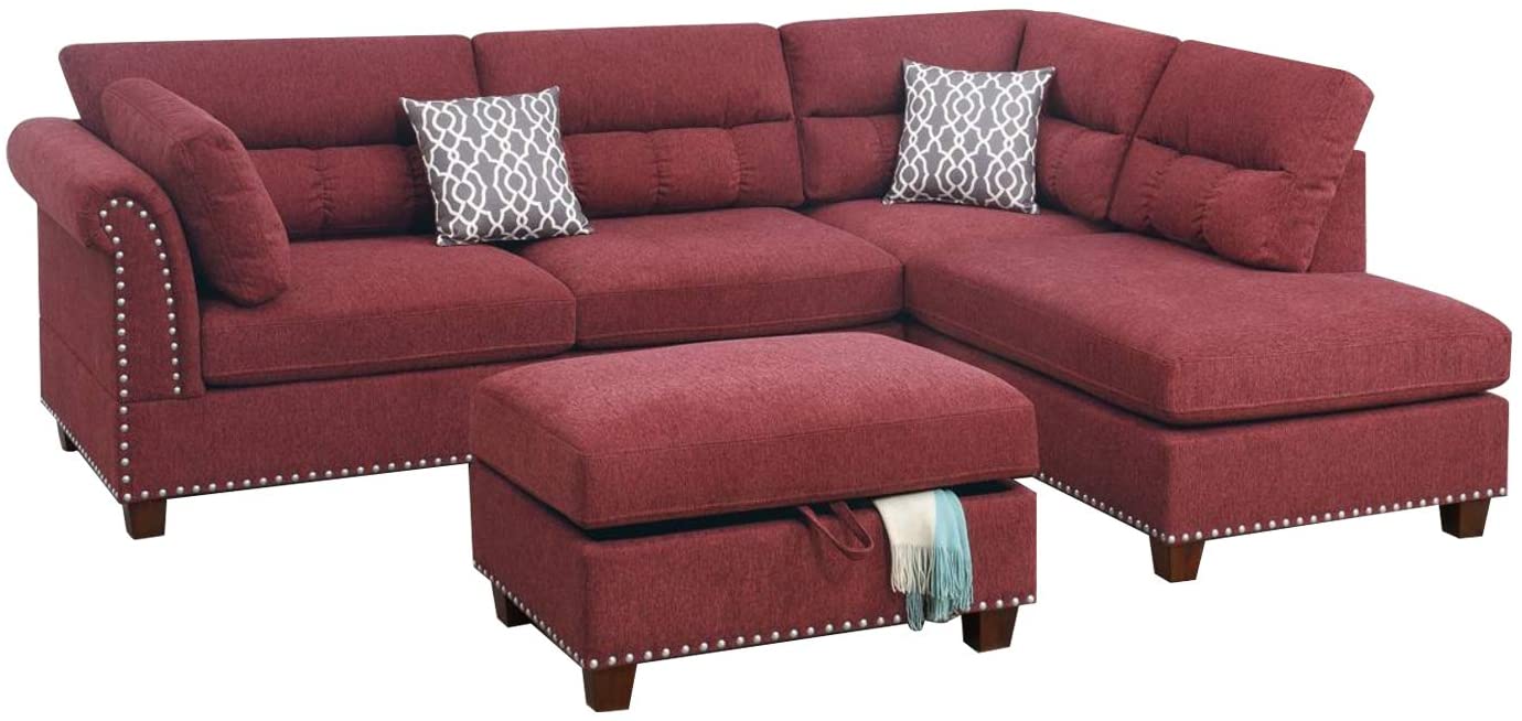 Deep red tufted sectional sofa with decorative nailhead trim and matching storage ottoman