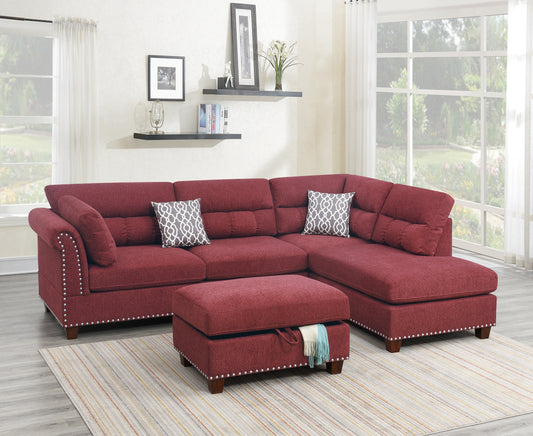 Deep red fabric sectional sofa with nailhead trim and decorative pillows offering a classic style