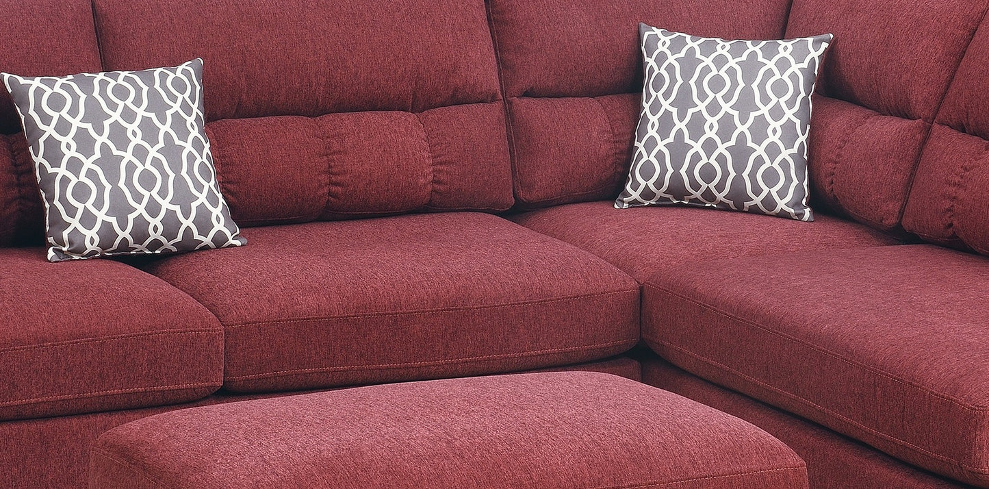 Deep red sectional sofa with diamond pattern accent pillows perfect for a modern living room