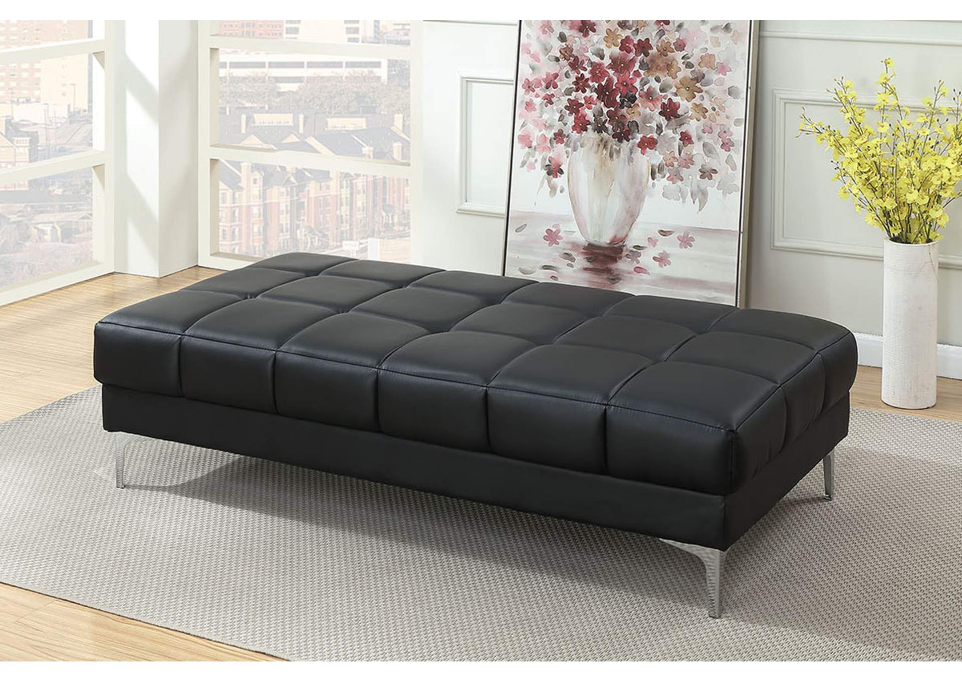 Tufted black leather ottoman with chrome legs perfect for living rooms