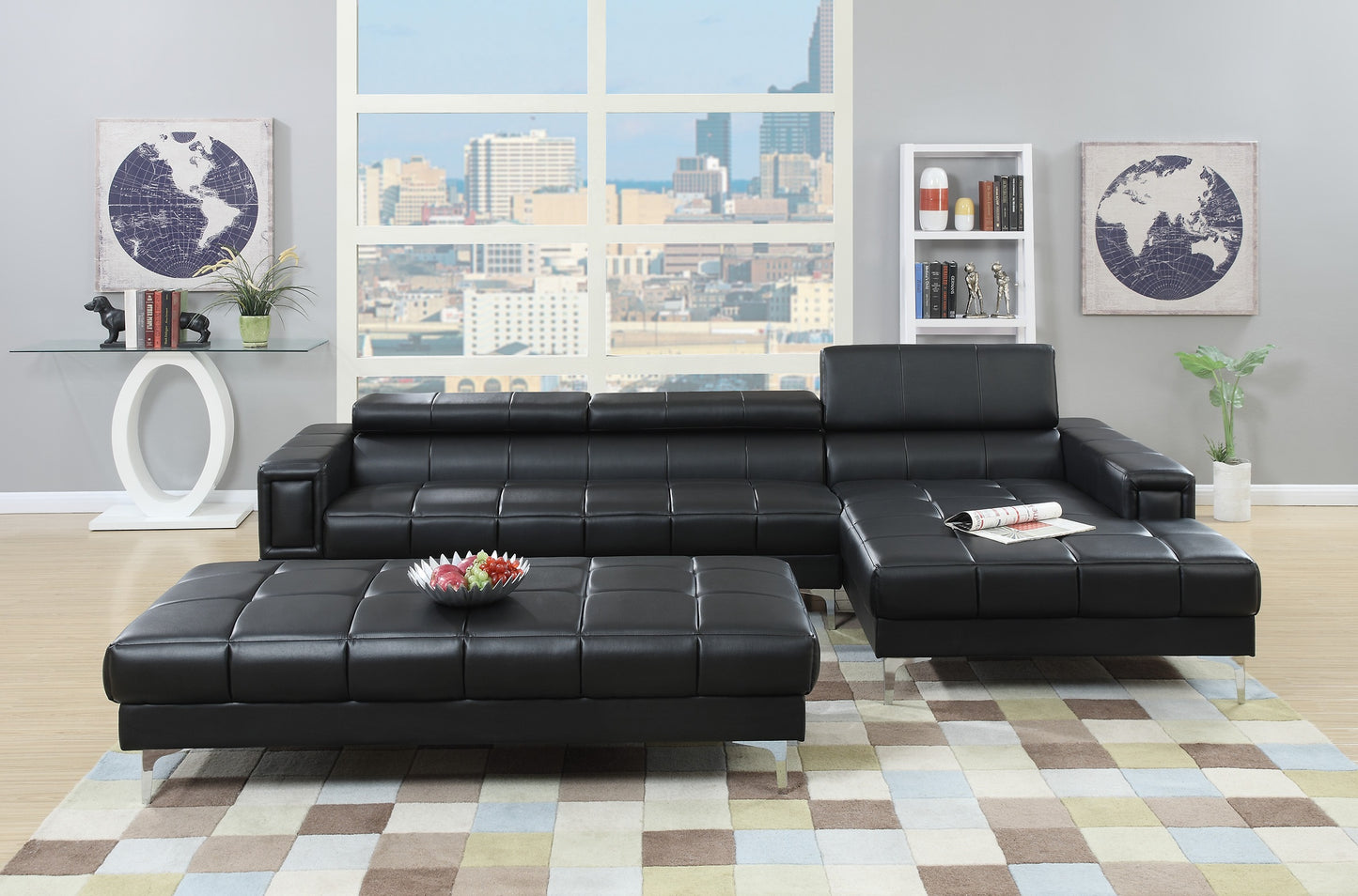 Black leather sectional sofa with tufted cushions and silver legs perfect for modern living rooms