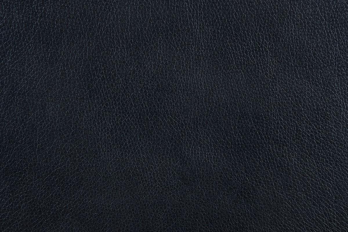 Closeup of textured navy blue genuine leather material
