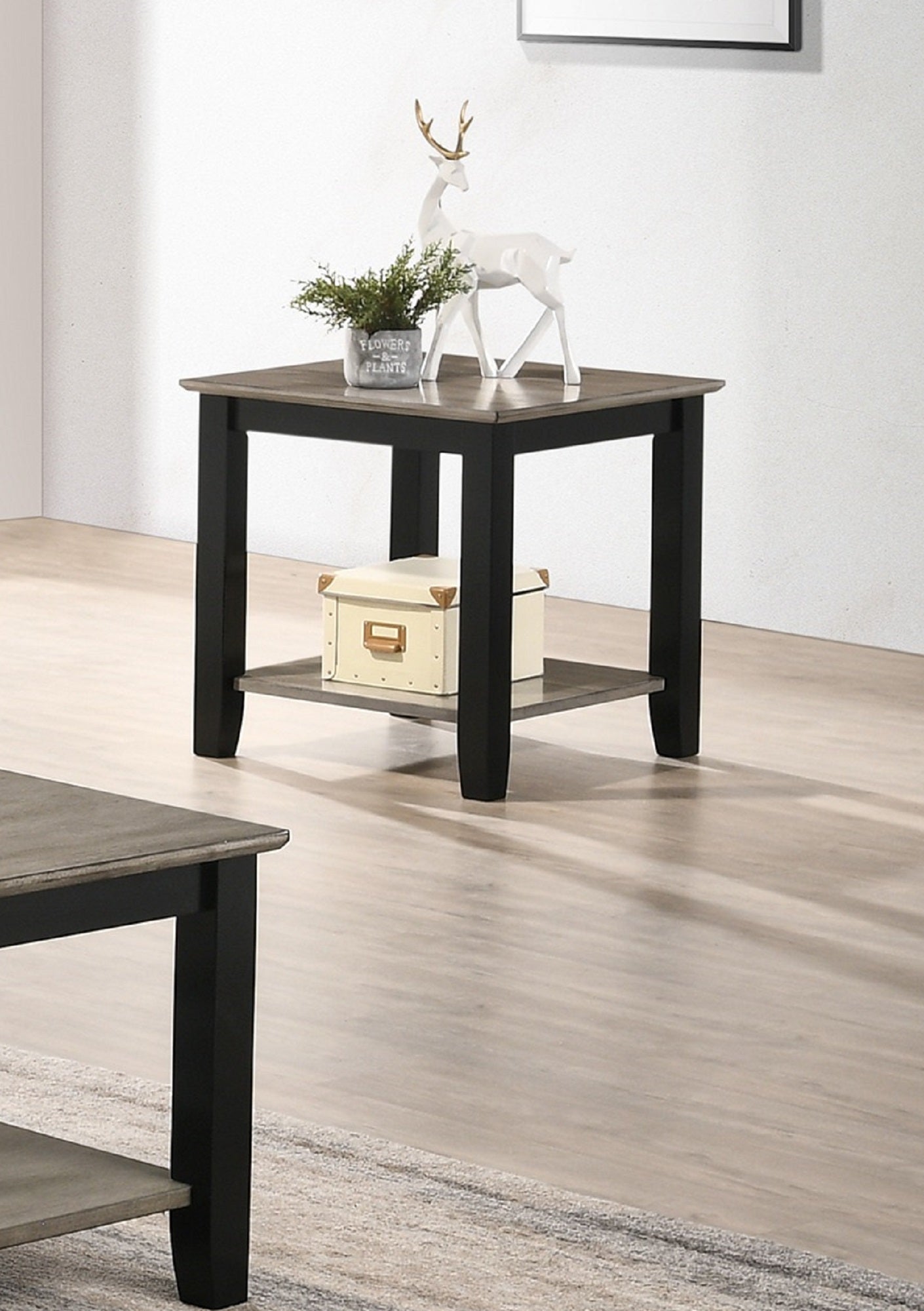 Black and grey twotone end table with a lower shelf perfect for living room accents