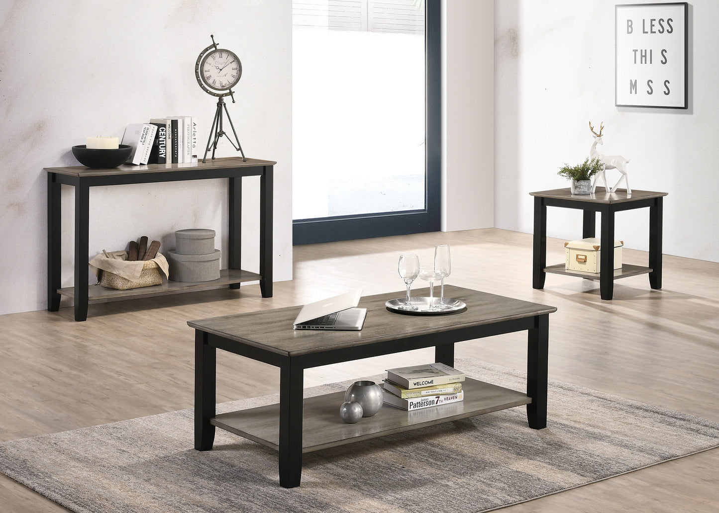 Rustic grey wood coffee table with black frame two shelves and a laptop