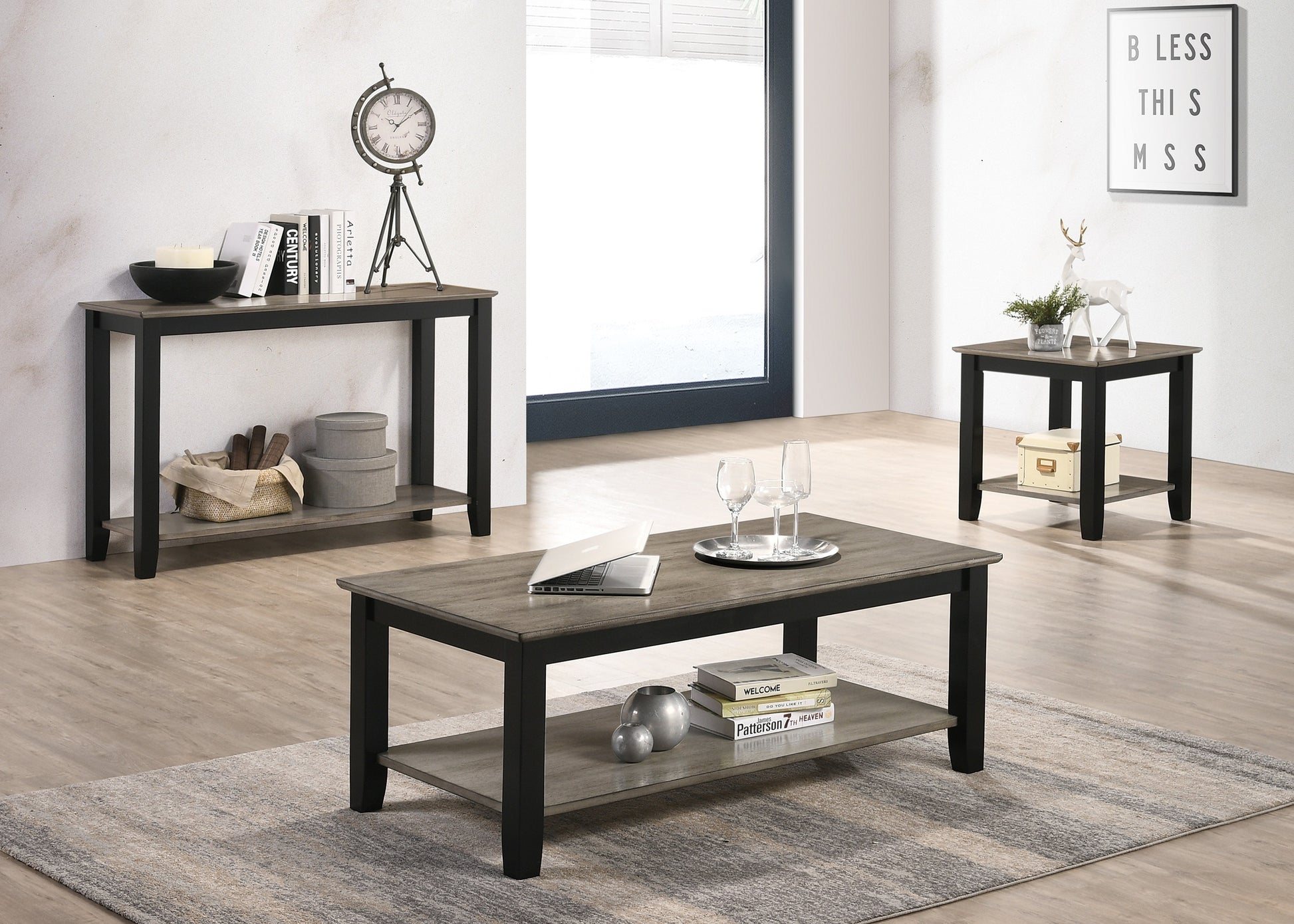 Rustic grey wood coffee table with black frame two shelves and a laptop