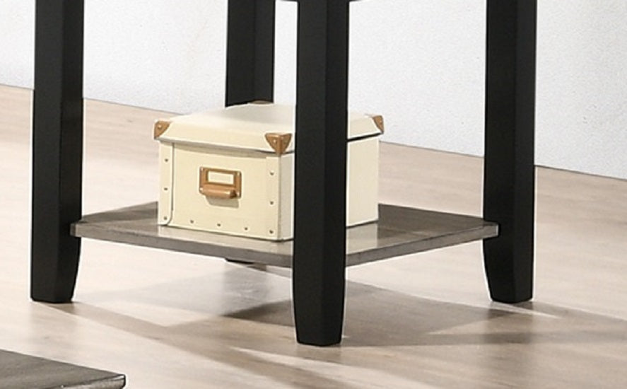 Cream storage box with gold accents on dark wood shelf of accent table
