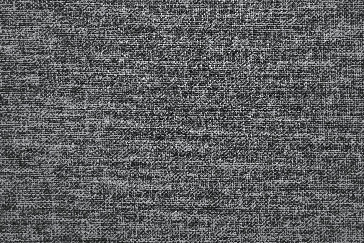 Closeup of a dark grey woven fabric texture with visible threads for upholstery projects