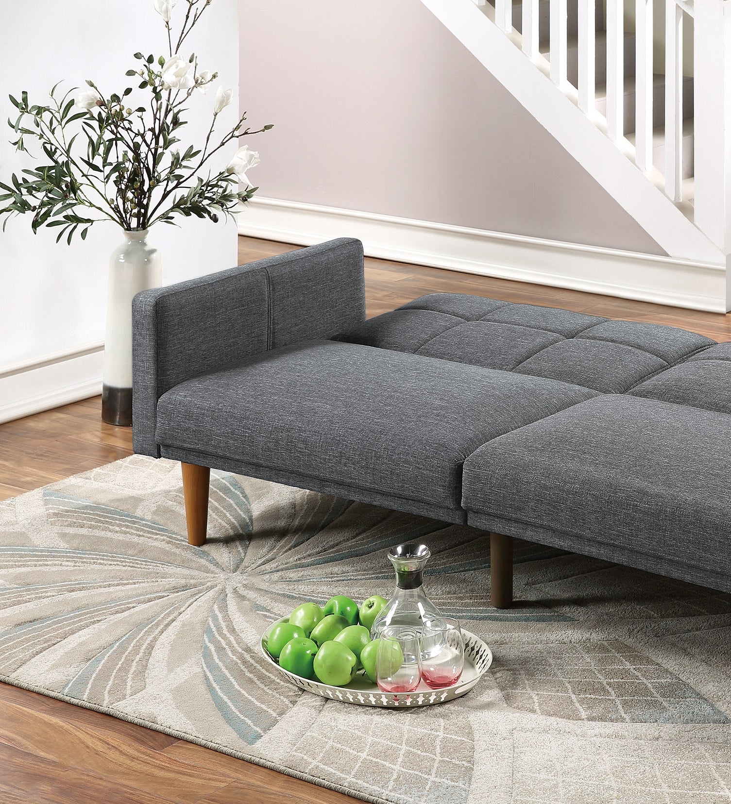 Gray fabric convertible sofa with tufted back cushions perfect for small spaces