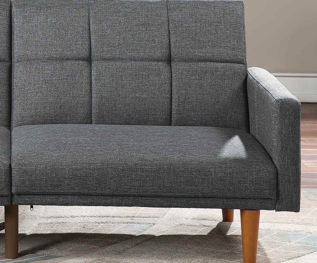 Dark gray tufted fabric sofa with square stitching and tapered wooden legs