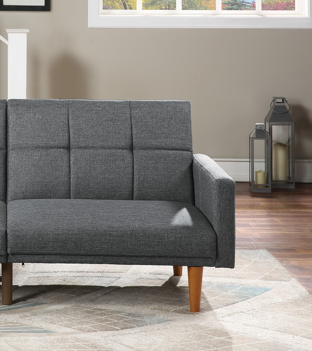 Tufted charcoal gray linen sofa with tapered wooden legs modern style