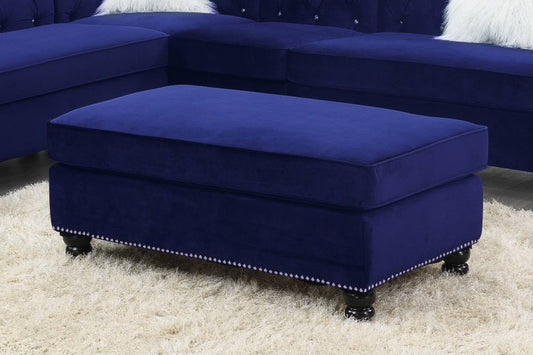 Deep blue velvet ottoman with silver nailhead trim and dark wood legs